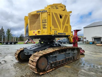 Tracteur forestier sur chenilles CATERPILLAR XT430-5 d'occasion de qualité avec pelle rétrocaveuse et chargeur frontal