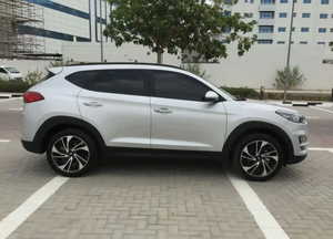 2021 pour Hyundai Tucson SUV I4 d'occasion prêt à conduire sans accident faible kilométrage intérieur en cuir foncé boîte de vitesses automatique AWD gauche - Product Image 2