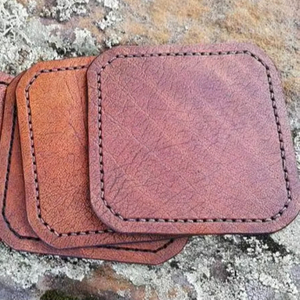 Long lasting rustic leather coasters with beautiful grain texture for a stylish and functional drink surface - Product Image 1