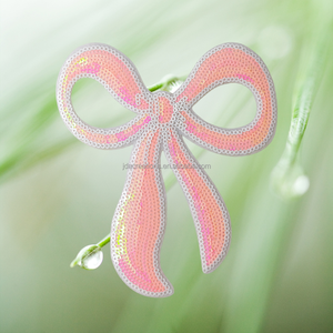 Patch thermocollant en sequins rose avec nœud pour accessoires vestimentaires - Product Image 1