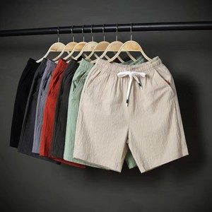 Été Nouveau Short décontracté en polyester pour hommes Taille élastique Respirant Léger Pantalon de plage ample à cinq points pour hommes - Product Image 1