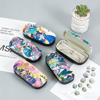 Étui à lunettes rigide en gros OEM/ODM pour femmes, étui à lunettes de soleil en cuir PU imprimé floral avec logo personnalisé