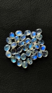 Cabochon de pierre de lune arc-en-ciel de haute qualité 3x5mm ovale pierre de lune lisse pierres de feu bleues pour bijoux prix de gros Lot - Product Image 4