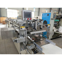 Machine d'emballage de papier toilette à double couche contrôlée par PLC avec une capacité de production de 4 à 6 sacs/min