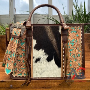 Nueva venta al por mayor 2025 de fábrica de moda de gran capacidad patrón Floral hecho a mano cuero de vaca genuino borla bolso de mano con cremallera - Product Image 1