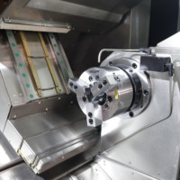 Tour à métaux CNC à double broche au prix le plus bas, avec tourelle motorisée, outillage en direct, lit de tour en fonte