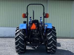 NEW HOLLAND TL100/Tracteur d'occasion 4X4wd New Holland T110 avec chargeur et matériel agricole à vendre Machines agricoles - Product Image 3