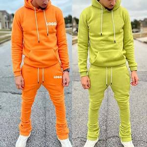 Conjunto de chándal con capucha y pantalones de chándal acampanados apilados de algodón 100% de corte regular de color sólido con logotipo personalizado para hombre - Product Image 1