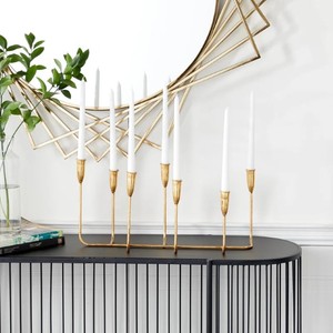 Gold Metal Aluminium Slim <b>Candle</b> Candelabra is a decorative <b>candle</b> <b>holder</b> designed to hold up to seven <b>candles</b> - Product Image 4