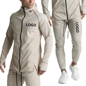 Venta caliente en línea 2025 Trajes de chándal con logotipo personalizado Hombres Deporte Conjunto de 2 piezas Chándal con cremallera Chándal cortavientos en blanco Hombres - Product Image 1