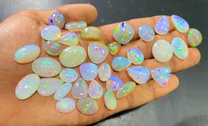 โอปอลไฟเอธิโอเปียแท้ทรงหลังเบี้ยสีขาว  โอปอลแท้รับรองคุณภาพ 5-8 กะรัต สำหรับทำเครื่องประดับ Mehradjuddin Gems - Product Image 6