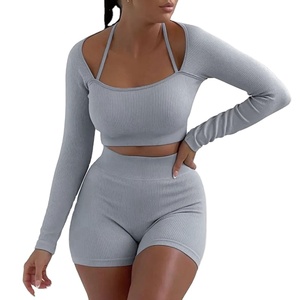 Gran oferta 2025, traje deportivo de dos piezas para mujer, Top corto ajustado de punto acanalado, pantalones cortos de manga larga, diseño Halter sólido, botón 6XL de invierno - Product Image 1