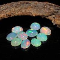 Vente en gros de cabochons ovales en opale éthiopienne blanche naturelle Welo Fire Opal Pierres précieuses en vrac pour la fabrication de bijoux pendentifs Approvisionnement en vrac