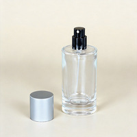 Vente en gros de flacons de parfum cylindriques en verre transparent 30ml/50ml/100ml avec vaporisateurs à fine brume pour recharges de parfum