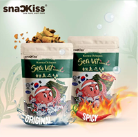 Boîte de snacks aux légumes épicés et au poulpe, texture croustillante, snacks aux fruits de mer