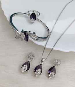 Ensemble de bijoux AD, collier avec pendentif, boucles d'oreilles, bague et bracelet, style minimaliste, parfait pour les soirées, finition haut de gamme, haute qualité - Product Image 1