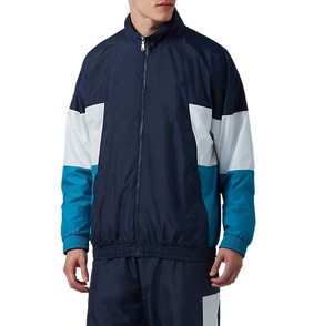 Chaqueta Cortavientos Personalizada de Estilo Urbano para Hombre, de Algodón y Lona, con Cuello Alto, Bloques de Color, Bolsillo con Solapa Frontal y Forro de Malla - Product Image 1