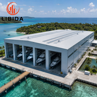 Hangar métallique préfabriqué à grande portée résistant au vent, à la neige et aux tremblements de terre, entrepôt d'usine, hangar pour bateaux, bâtiment métallique personnalisé, hangar pour bateaux en acier
