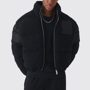 Chaqueta de estilo urbano para hombre, con tejido polar texturizado, paneles de manga lisos, cuello alto, cierre frontal con cremallera y bolsillo de parche en el pecho. - Product Image 1