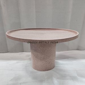 Minimalist Pink Coffee <b>Table</b> With a <b>Rounded</b> Shape and a Textured Speckled Design Built With Durable Metal for a Modern Aesthetic - Product Image 1