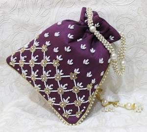 2025 @ Dazzling <b>Purple</b> Potli Bags on Raw silk Fabric with Embellished Pearls, Crystal Glass Beads Work for Party-wear/Wedding - Product Image 1