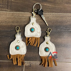 Nouvel arrivage de porte-clés en cuir de vachette Porte-clés mignon en cuir de forme exotique Porte-clés à franges turquoise en cuir de vachette pour unisexe - Product Image 1