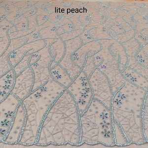 Tissu en dentelle perlée haut de gamme avec broderie complexe pour les robes de soirée de mariée et la mode de luxe disponibles à la vente - Product Image 2