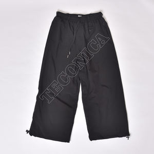 Pantalon de neige imperméable noir OEM avec cordon de serrage à la taille et doublure en polaire pour le ski et les activités par temps froid - Product Image 1