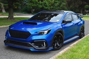 Subaru WRX 2022 d'occasion en excellent état, boîte manuelle 6 vitesses, modifications esthétiques et audio importantes - Product Image 1