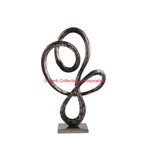 Sculpture moderne en métal avec nœud en ruban et base en granit noir Décoration contemporaine élégante pour la maison et le bureau Accent décoratif - Product Image 2