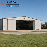 Hangar d'avion préfabriqué en acier à ossature à pignon, bâtiment de stockage d'avions multifonctionnel avec grande porte pliante, facile à l'extension