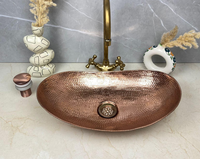 Lavabo ovale en cuivre martelé de design moderne pour comptoir de cuisine domestique, prix compétitif, disponible en plusieurs modèles de bassins et de cuves