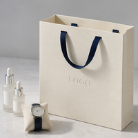 Sac de courses en papier recyclable personnalisé avec logo en aluminium pour l'emballage de sérum de soin de la peau, de flacons de parfum et de montres