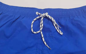 กางเกงขาสั้นชายหาดดีไซน์เนอร์คุณภาพสูง สีสันหลากหลาย แบบสั่งทำพิเศษ ผ้าไนลอนสีพื้นเท่ๆ สำหรับผู้ชาย - Product Image 4