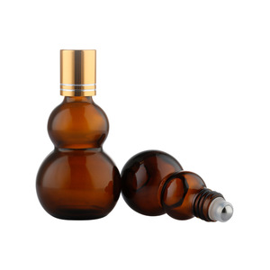 Flacon roll-on <span class=keywords><strong>en</strong></span> verre ambré <span class=keywords><strong>en</strong></span> forme de <span class=keywords><strong>gourde</strong></span> avec bouchon doré mat, rechargeable, protection UV, pour huiles essentielles et parfums, lot de 100 pièces <span class=keywords><strong>en</strong></span> carton - Product Image 1