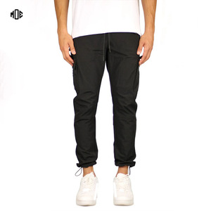 Pantalones de chándal Cargo de nailon de secado rápido personalizados para hombre, pantalones de jogging transpirables Unisex de talla grande, pantalones holgados con bolsillo y cremallera, impermeables - Product Image 1