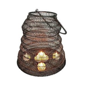 <b>Moroccan</b> style metal candle votive with handle and ornate details for festive occasions and ethnic interior design - Product Image 1
