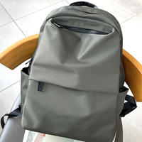 Sac à dos scolaire et de voyage unisexe en nylon noir, grande capacité, imperméable, fermeture éclair, style minimaliste, décontracté, pour usage quotidien