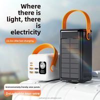 Batterie externe solaire d'urgence noire 50000mAh 22.5W pour extérieur avec 4 câbles intégrés, lampe torche LED, support et poignée de transport