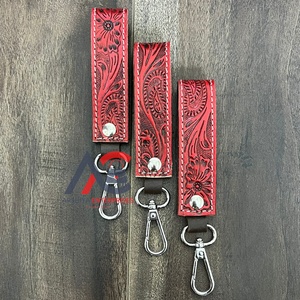 Nouveau 2025 Vente en gros Porte-clés en cuir de vachette personnalisé à motif floral, élégant, sculpté à la main et estampé, avec dragonne en cuir et pince à clés mignonne - Product Image 1