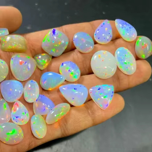 โอปอลไฟเอธิโอเปียแท้ทรงหลังเบี้ยสีขาว  โอปอลแท้รับรองคุณภาพ 5-8 กะรัต สำหรับทำเครื่องประดับ Mehradjuddin Gems - Product Image 1