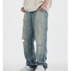 กางเกงยีนส์ผู้ชายทรงเฟลร์แบบวินเทจฟอกสี ขาดเซอร์ๆ สไตล์ดิสเทรส รูขาดๆ คุณภาพดี รับผลิตแบบ OEM ขายส่ง - Product Image 2