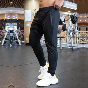 Pantalones de chándal de poliéster para correr en blanco elásticos para hombre, pantalones transpirables para correr en el gimnasio para hombre - Product Image 4