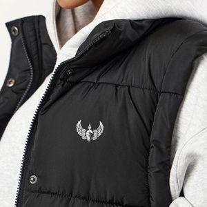 Chaleco largo acolchado negro para mujer, con cremallera completa, ligero, aislante, sin mangas, para uso casual en invierno. - Product Image 4