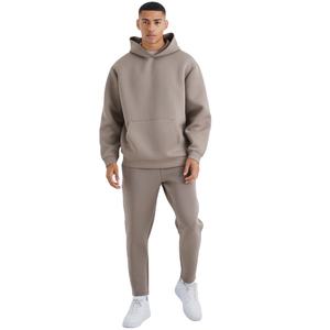 Ensemble pantalon de survêtement et sweat à capuche personnalisés Survêtement baggy évasé en coton vierge surdimensionné et uni de poids lourd pour hommes - Product Image 1