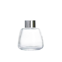 Bouteilles de diffuseur à roseaux rondes 100ml 200ml 300ml en verre scellées au liège sérigraphiées pour parfum d'ambiance