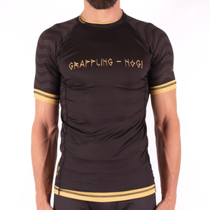 Haute qualité MMA personnalisé éruption pour la formation à manches courtes Compression Spandex toile conception solide enfants hommes BJJ combat - Product Image 5