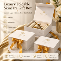 Boîte cadeau de luxe personnalisée gaufrée pliable pour soins de la peau avec nœud en ruban, couvercle et base rigides en carton pour ensembles cosmétiques de spa
