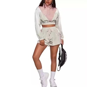 2025 diseño al por mayor elegante personalizado de alta calidad deporte corto media cremallera mujeres Cargo Nylon chándal rompevientos conjuntos - Product Image 1