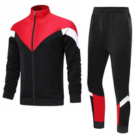 Survêtement sportif pour homme, bleu, noir et blanc, avec blocs de couleur, col roulé zippé, poches latérales, idéal pour l'automne